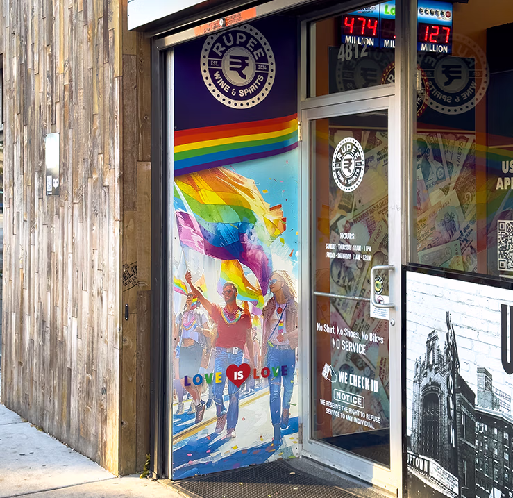 Rupee Wine & Spirits storefront entrance featuring custom branded window graphics and colorful mural artwork.